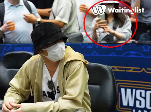 田中圭と中継に映ったロングヘア女性